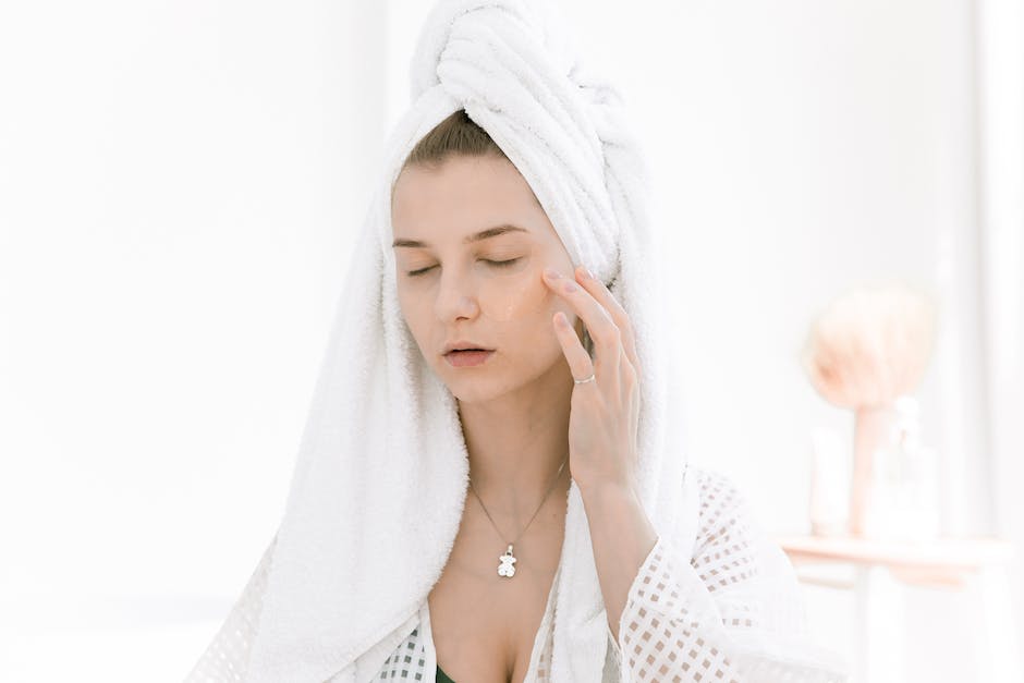 Image of a woman applying a homemade face mask for a DIY beauty routine