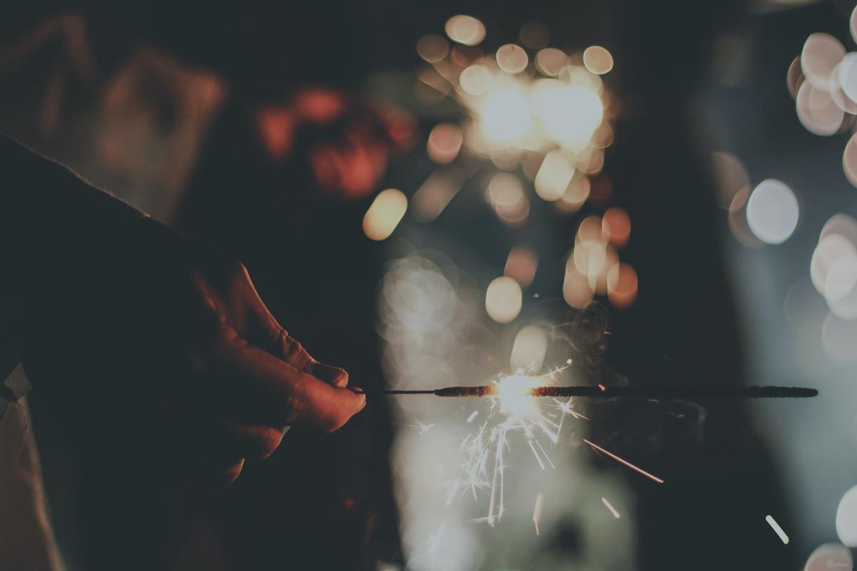 An image of a person holding a light bulb illustrating possibilities of energy conservation.