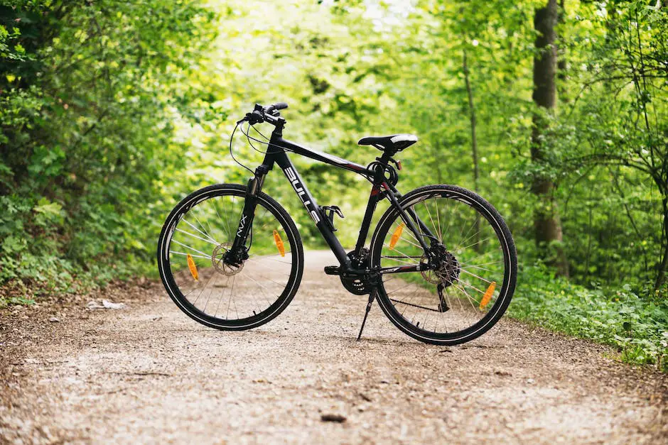 Image depicting a person on a bike with a beautiful green and blue scenery in the background.